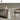 Tostone Elegant Beige Round Travertine Dining Table with Hourglass Leg Design
